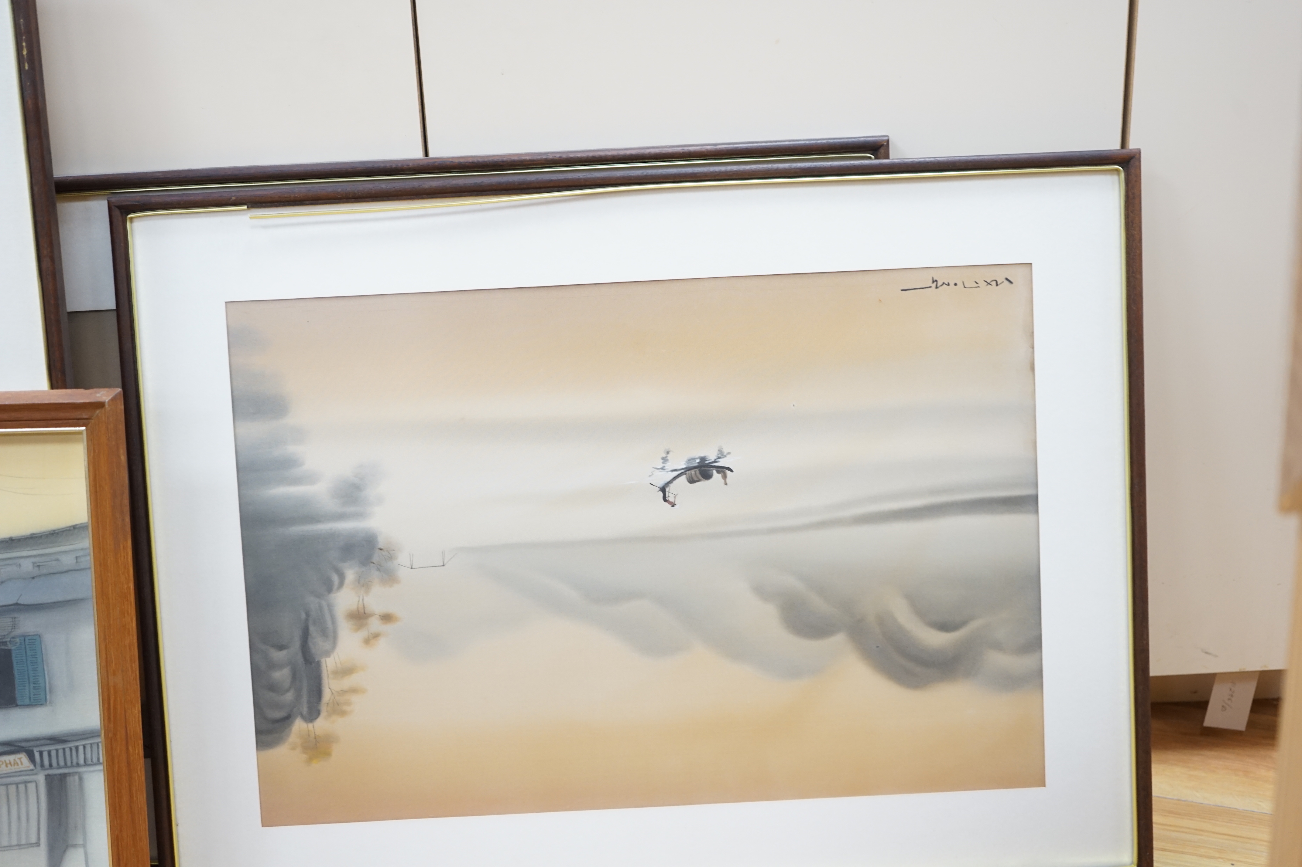 Four 20th century Vietnamese watercolour paintings on silk depicting street scene, lake scene and rice planting, all signed, largest 56 x 36cm, glazed frames